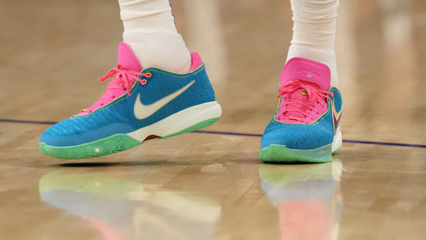View blue and pink Nike LeBron shoes.